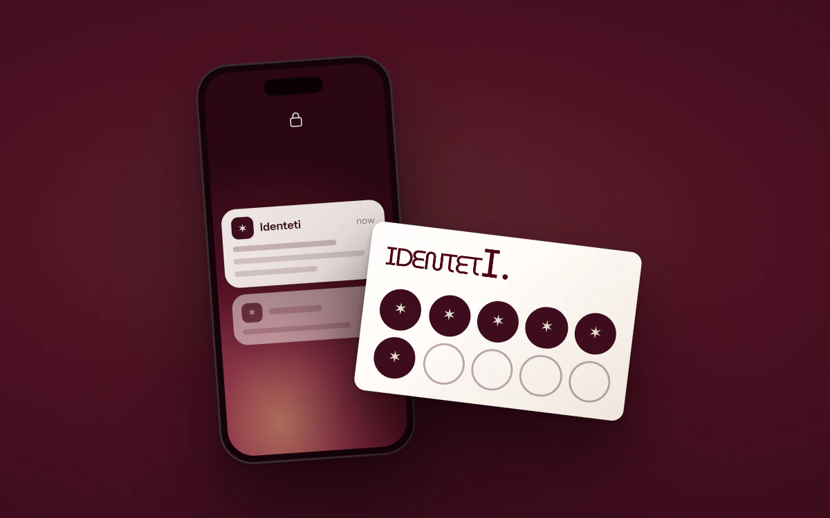 An illustration of an email from Identeti arriving on a phone, with a loyalty card collecting stamps in front of it.